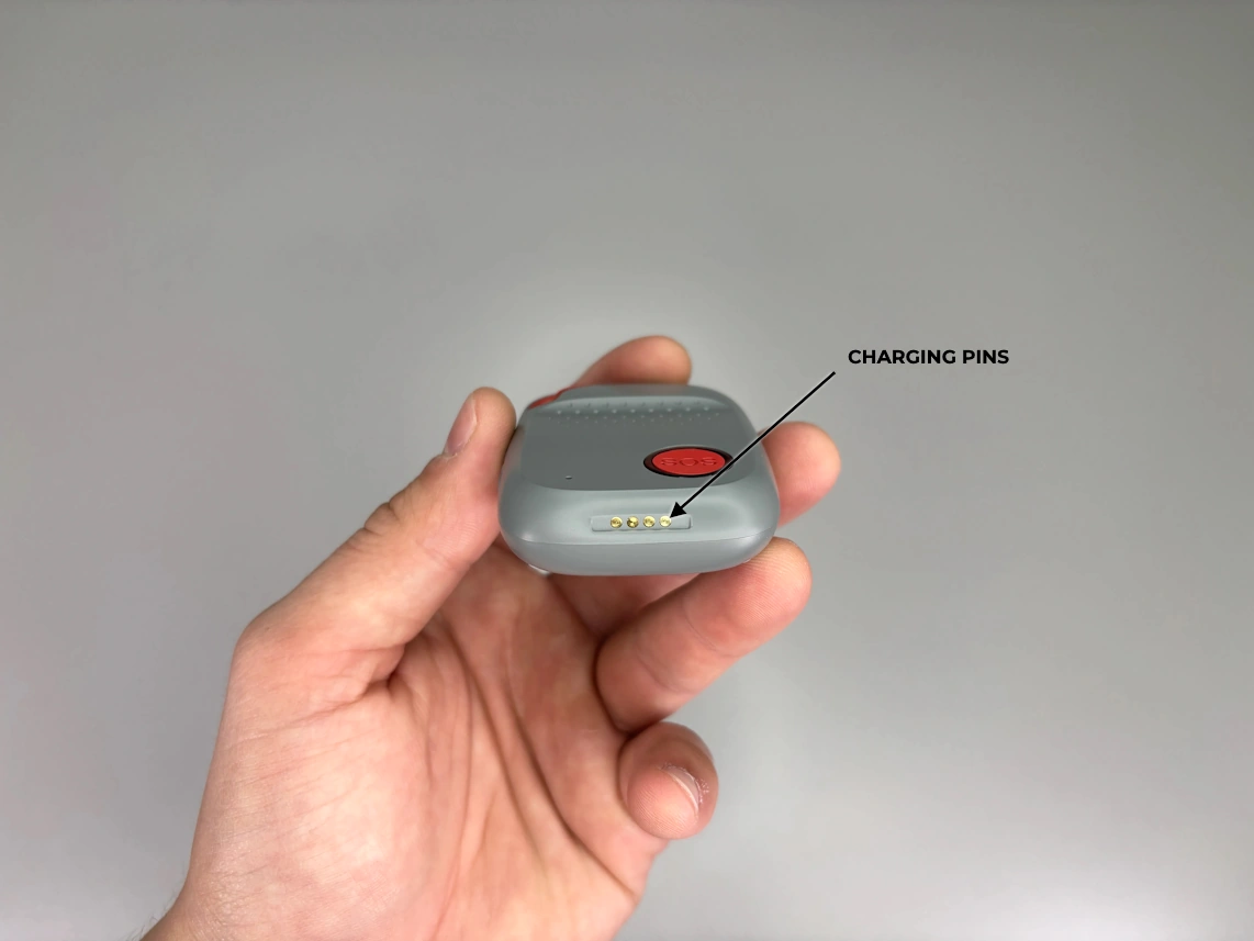 medical alert wristband on persons hand with the arrow pointed at wristband